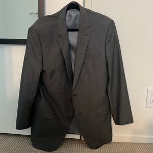 Grey fitted suit. Andrew Fezza brand. Jacket and pants included.